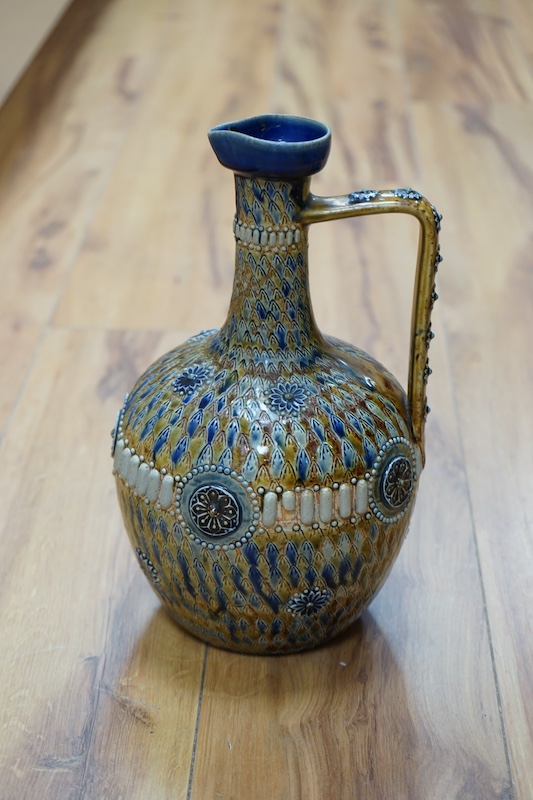 A Doulton Kingsware ewer and a Doulton stoneware jug, c.1882, tallest 29cm high. Condition - chip to Kingsware ewer lip and part of lozenge on body of jug missing, base of handle reglued and rim of jug crazed and split